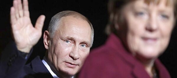 普京与默克尔 - 俄罗斯卫星通讯社