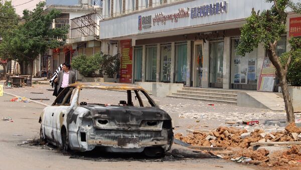 A burnt car left on a street in Lauk kai, along the China-Myanmar border in the northern Shan State of Myanmar - 俄羅斯衛星通訊社