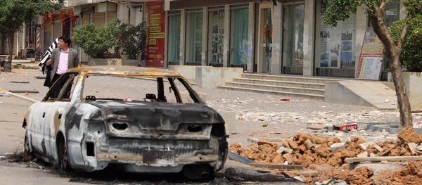 A burnt car left on a street in Lauk kai, along the China-Myanmar border in the northern Shan State of Myanmar - 俄罗斯卫星通讯社