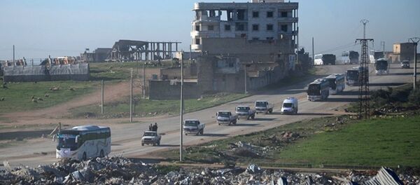 從敘利亞霍姆斯省再次運出百名武裝分子 從敘利亞霍姆斯省再次運出百名武裝分子 - 俄羅斯衛星通訊社