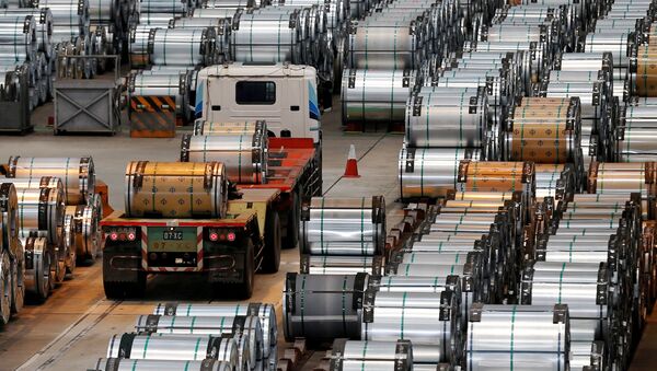 A truck drives past rolls of steel inside the China Steel Corporation factory - 俄罗斯卫星通讯社