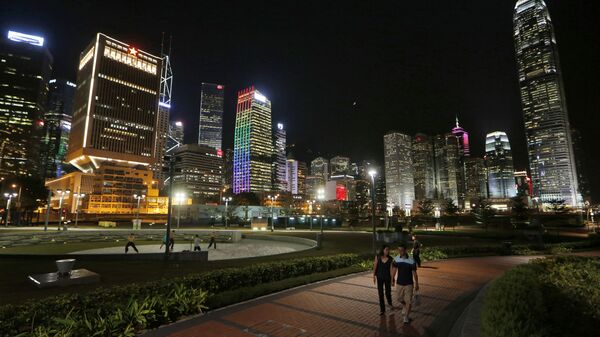 High-rise commercial buildings are lit up at night in Hong Kong - 俄罗斯卫星通讯社