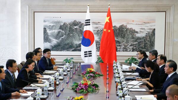 South Korean special envoy Lee Hae-chan and Chinese Foreign Minister Wang Yi attend a meeting at the foreign ministry in Beijing - 俄罗斯卫星通讯社