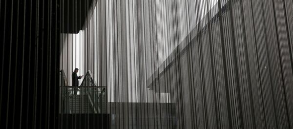 A man looks at a phone during the third annual World Internet Conference in Wuzhen town of Jiaxing - 俄羅斯衛星通訊社