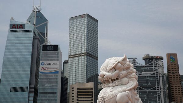 A lion sculpture is seen in front of office towers at the financial Central district in Hong Kong - 俄羅斯衛星通訊社