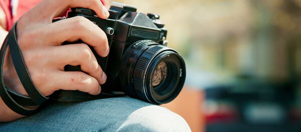 Фотограф с камерой - 俄罗斯卫星通讯社