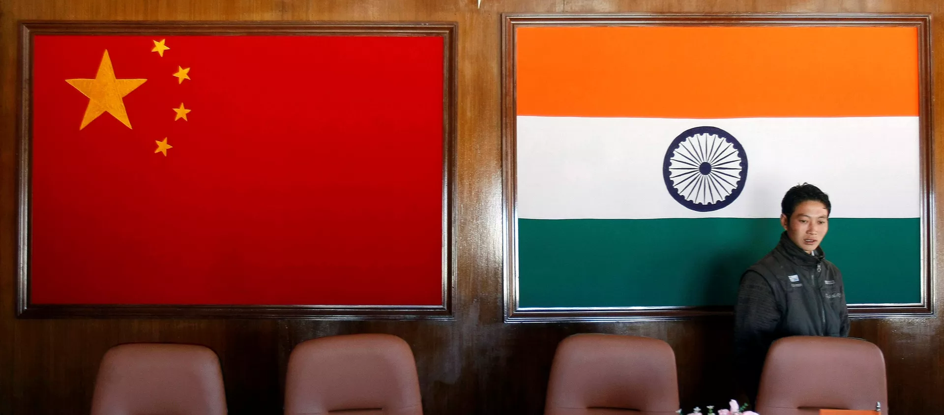 A man walks inside a conference room used for meetings between China and India - 俄羅斯衛星通訊社, 1920, 10.02.2021