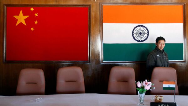 A man walks inside a conference room used for meetings between China and India - 俄羅斯衛星通訊社