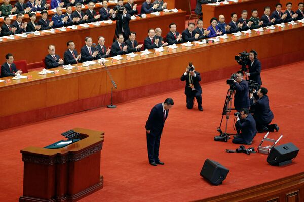 中国国家主席习近平在开幕式上作报告。 - 俄罗斯卫星通讯社