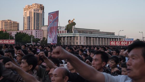 Participants of a mass rally shout slogans as they gather on Kim Il-Sung sqaure in Pyongyang - 俄羅斯衛星通訊社