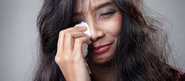 Молодая азиатская девушка плачет - 俄罗斯卫星通讯社