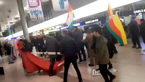 A fight breaks out during a demonstration against Turkish military operation in Syria, in the Hannover Airport, Germany - 俄罗斯卫星通讯社