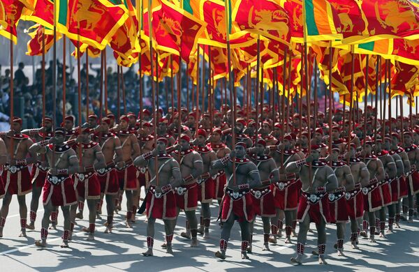 中國全國政協副主席王欽敏周日在科倫坡同斯里蘭卡總統西里塞納回會晤時宣讀了習主席的賀詞。通常國慶賀電看上去,首先是回答那些挑撥中斯兩國的人。 中國全國政協副主席王欽敏周日在科倫坡同斯里蘭卡總統西里塞納回會晤時宣讀了習主席的賀詞。通常國慶賀電看上去,首先是回答那些挑撥中斯兩國的人。 - 俄羅斯衛星通訊社