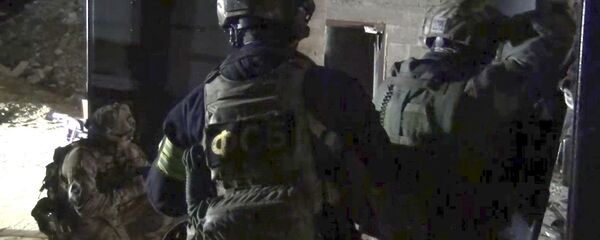 Сотрудники правоохранительных органов во время спецоперации в Дагестане. Архивное фото - 俄罗斯卫星通讯社