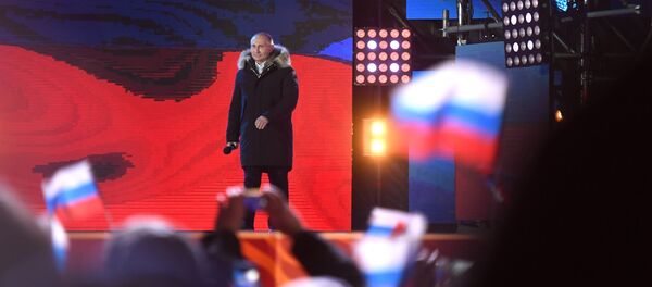 Президент РФ Владимир Путин на митинг-концерте на Манежной площади в Москве, посвященном годовщине воссоединения Крыма с Россией Президент РФ Владимир Путин на митинг-концерте на Манежной площади в Москве, посвященном годовщине воссоединения Крыма с Россией - 俄罗斯卫星通讯社