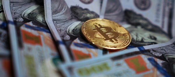 Сувенирная монета с логотипом криптовалюты биткоин Сувенирная монета с логотипом криптовалюты биткоин - 俄羅斯衛星通訊社