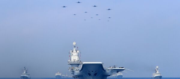 Warships and fighter jets of Chinese People's Liberation Army (PLA) Navy take part in a military display in the South China Sea - 俄罗斯卫星通讯社