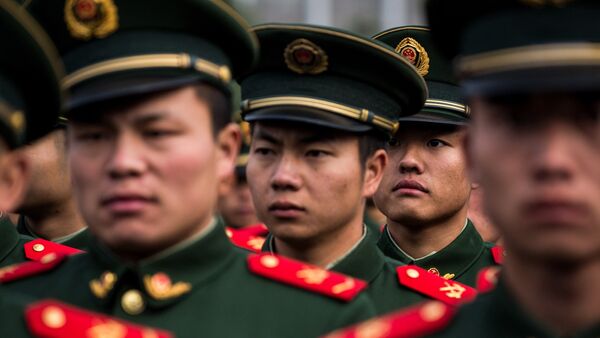 A People's Liberation Army (PLA) soldier looks on - 俄罗斯卫星通讯社