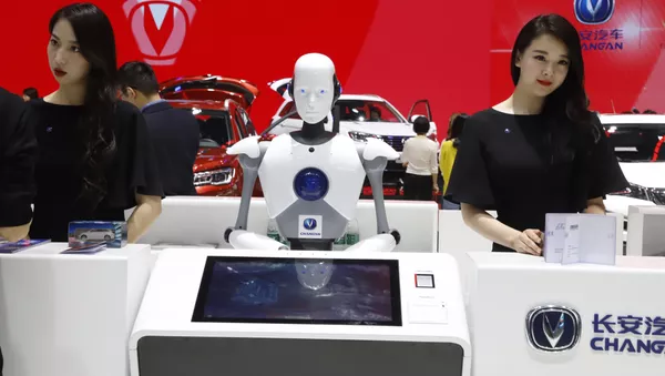 A robot assist receptionist is seen at the booth of a Chinese automaker during the China Auto 2018 show - 俄羅斯衛星通訊社
