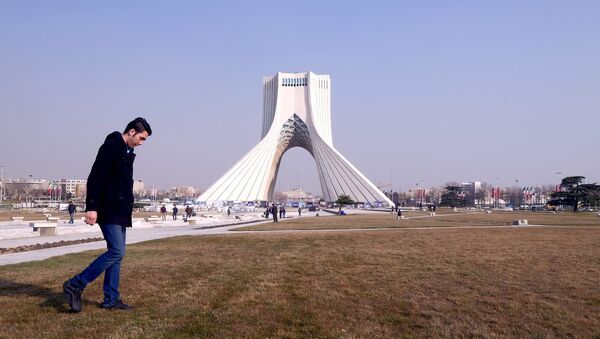 A man walks past Azadi Tower (Liberty Tower) in Azadi Square in Tehran - 俄罗斯卫星通讯社