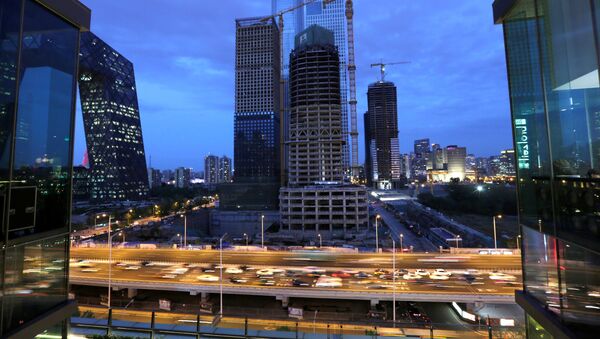 Vehicles drive through Beijing's central business area - 俄罗斯卫星通讯社