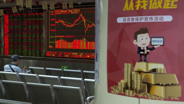 An investor eats his meal as he monitors stock prices near a poster which reads Rational investing starts from me at a brokerage in Beijing - 俄罗斯卫星通讯社