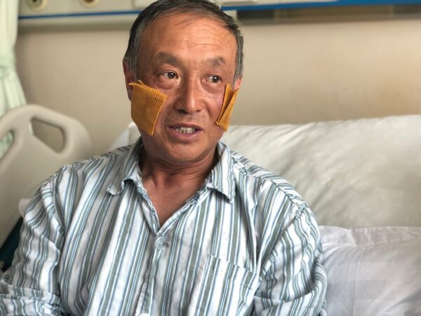 双脚截肢的70岁中国登山者夏博宇 双脚截肢的70岁中国登山者夏博宇 - 俄罗斯卫星通讯社
