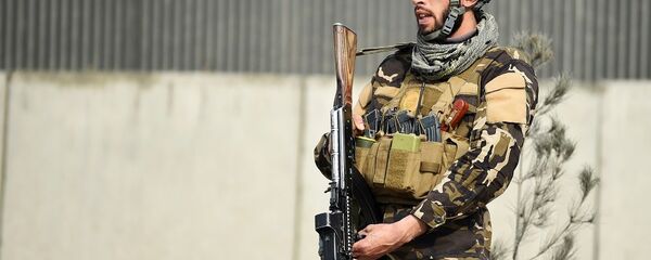 An Afghan security personnel An Afghan security personnel - 俄罗斯卫星通讯社