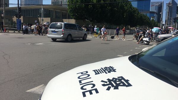 Police car is seen near the U.S. embassy in Beijing - 俄羅斯衛星通訊社