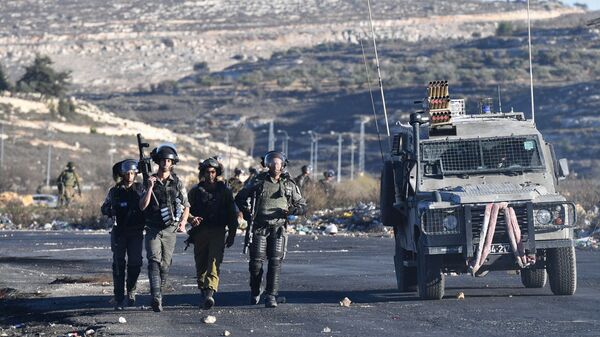 Сотрудники правоохранительных органов Израиля во время столкновений на границе Палестины и Израиля. Архивное фото - 俄羅斯衛星通訊社