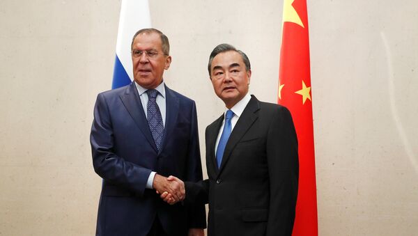 Russia's Foreign Minister Sergei Lavrov meets with China's Foreign Minister Wang Yi on the sidelines of the ASEAN Foreign Ministers' Meeting in Singapore - 俄罗斯卫星通讯社