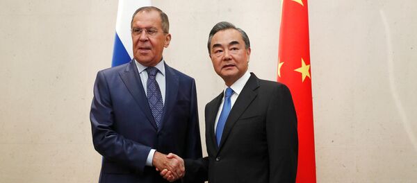 Russia's Foreign Minister Sergei Lavrov meets with China's Foreign Minister Wang Yi on the sidelines of the ASEAN Foreign Ministers' Meeting in Singapore - 俄罗斯卫星通讯社