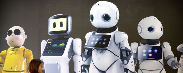 A visitor walks past a mural displaying robots from Chinese robot maker Canbot at the World Robot Conference in Beijing - 俄罗斯卫星通讯社