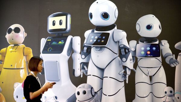A visitor walks past a mural displaying robots from Chinese robot maker Canbot at the World Robot Conference in Beijing - 俄罗斯卫星通讯社