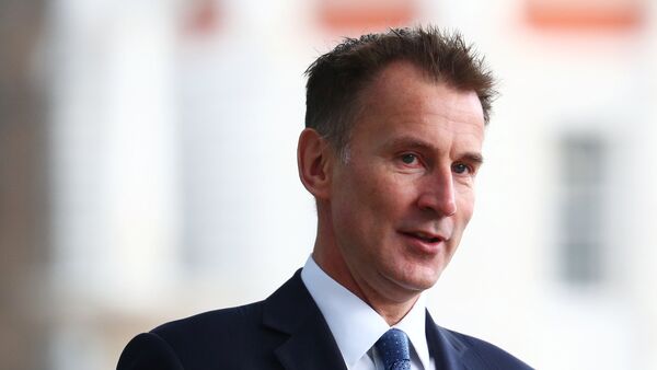 Britain's Foreign Secretary Jeremy Hunt arrives at the Foreign Office in Westminster, London - 俄羅斯衛星通訊社