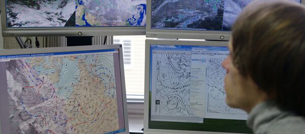 Сотрудник ФГБУ Гидрометцентр России за рабочим местом в Москве. - 俄羅斯衛星通訊社