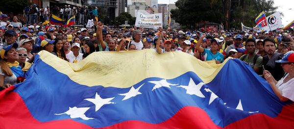 Протестующие против правительства президента Венесуэлы Николаса Мадуро в Каракасе, Венесуэла - 俄罗斯卫星通讯社