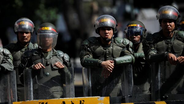 Security forces guard the entrance of a military building in downtown Caracas, Venezuela - 俄羅斯衛星通訊社