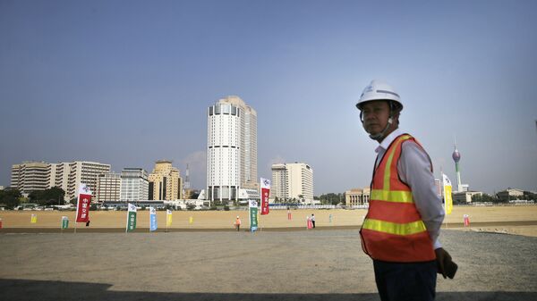 Китайский рабочий во время стройки в Коломбо. Шри-Ланка. - 俄羅斯衛星通訊社