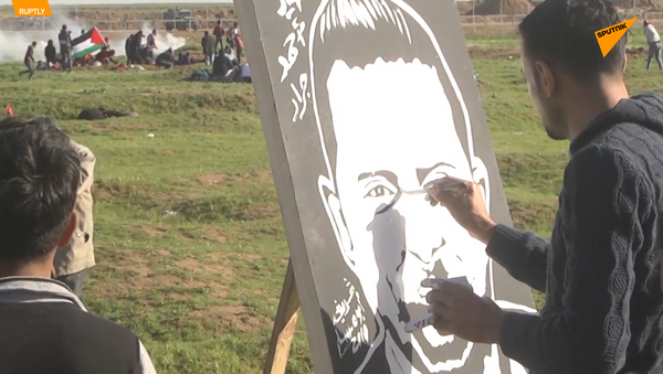 巴勒斯坦畫家邊境區作畫以聲援鬥爭 - 俄羅斯衛星通訊社