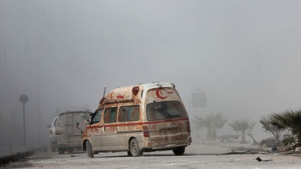 Автомобиль сирийского отделения красного полумесяца в Алеппо  - 俄罗斯卫星通讯社