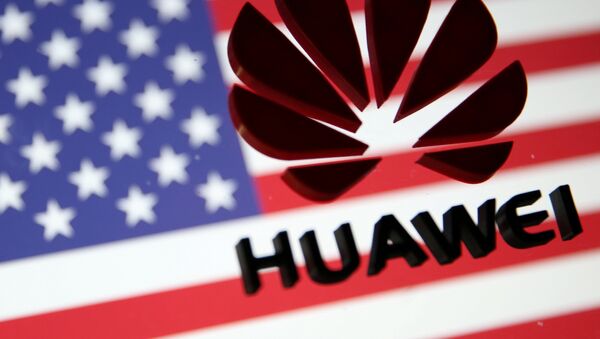 A 3D printed Huawei logo is placed on glass above a displayed U.S. flag in this illustration - 俄羅斯衛星通訊社