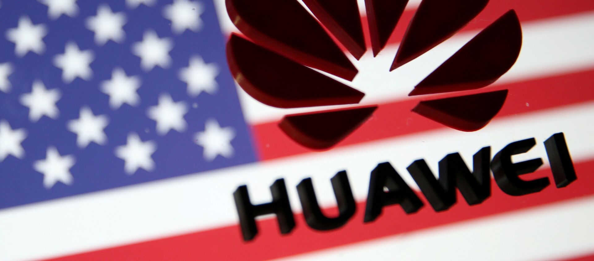 A 3D printed Huawei logo is placed on glass above a displayed U.S. flag in this illustration - 俄罗斯卫星通讯社, 1920, 18.06.2021