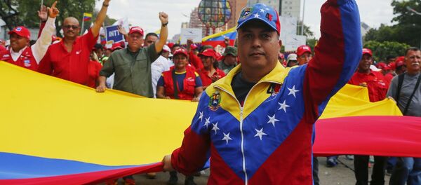 Участники акции в поддержку легитимного президента Венесуэлы Николаса Мадуро в Каракасе - 俄罗斯卫星通讯社