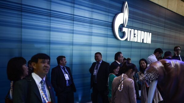 Посетитель у стенда компании Газпром на Мировой нефтяной выставке в МВЦ Крокус Экспо - 俄羅斯衛星通訊社