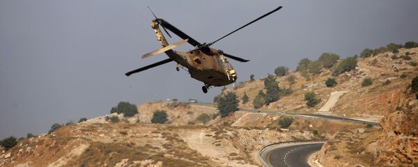 Израильский военный вертолет в районе Голанских высот Израильский военный вертолет в районе Голанских высот - 俄罗斯卫星通讯社