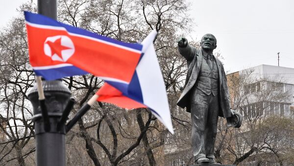State flags of Russia and North Korea fly in a street in Vladivostok - 俄羅斯衛星通訊社