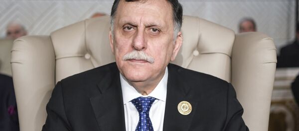 Премьер-министр Ливии Фаиз Сарадж и его супруга Надя Реффат Премьер-министр Ливии Фаиз Сарадж и его супруга Надя Реффат - 俄罗斯卫星通讯社