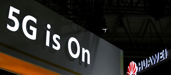 A Huawei logo is seen at an exhibition during the World Intelligence Congress in Tianjin - 俄羅斯衛星通訊社