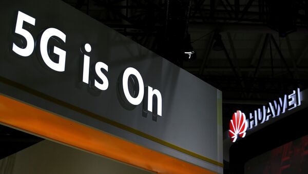 A Huawei logo is seen at an exhibition during the World Intelligence Congress in Tianjin - 俄羅斯衛星通訊社